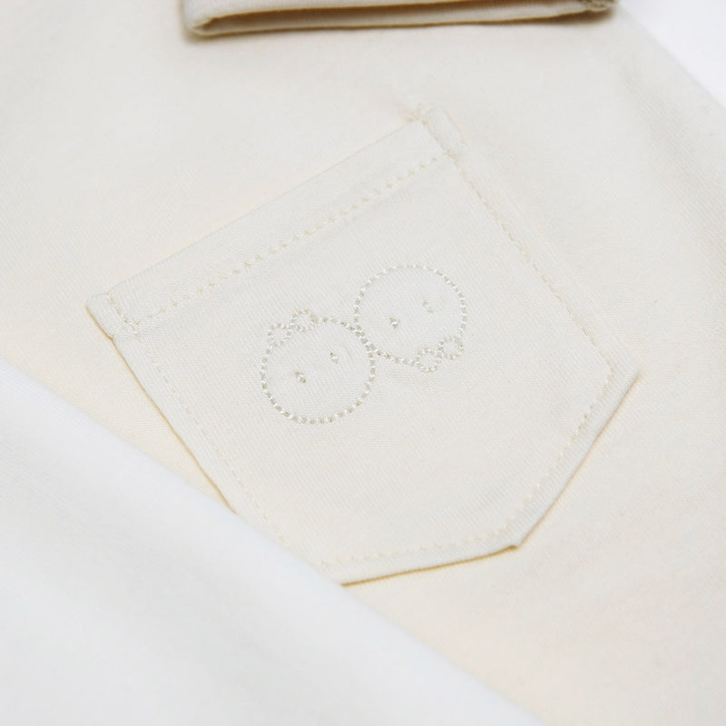 Organic onesie back pocket detail